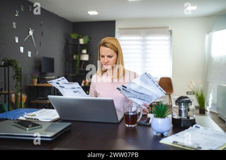 Blonde woman working with a lot of paperwork Stock Photo