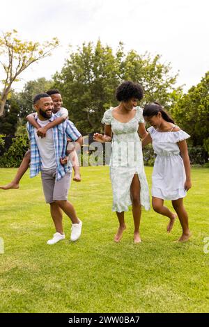 African American family enjoys a playful moment outdoors Stock Photo