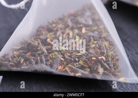 Triangular teabag with tea on a slate Stock Photo