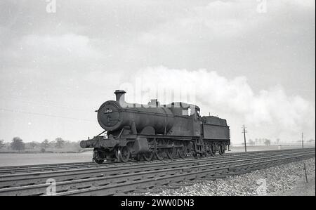 1950s, historical, Briitsh Railways steam locomotive, 3852, on the rail track, England, UK. Built at Swindon Works in 1942 for GWR, it continued in service until it was withdrawn in 1964. Stock Photo