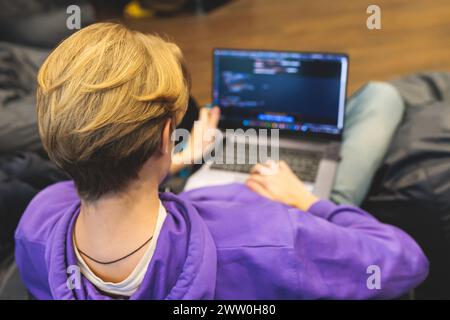 Software developer students in auditorium hall working on computer and laptop, programming contest hackathon competition, pc with coding program app, Stock Photo