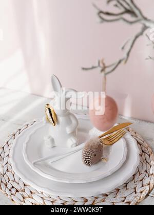 Easter Bunny Figurine With Table place setting Stock Photo