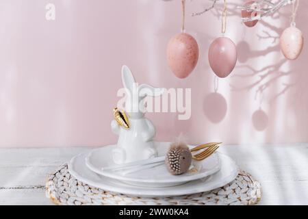 Easter Bunny Figurine With Table place setting Stock Photo