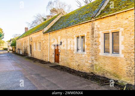 A view along a row of Almshouses beside the cathedral in Peterborough, UK on a bright sunny day Stock Photo