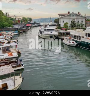 Goksu Stream, with docked group of different shapes, sizes and colors boats, located beside Anadolu Hisari historic castle on the Anatolian side of the Bosporus in Beykoz district, Istanbul, Turkey Stock Photo