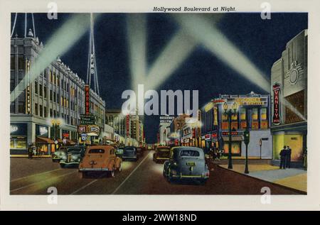 KFWB Radio Tower and Warner Theatre showing Cedric Hardwicke and Vincent Price in INVISIBLE MAN RETURNS on HOLLYWOOD BOULEVARD AT NIGHT postcard from Interesting HOLLYWOOD California postcard folder published in 1941 by Western Publishing & Novelty Co., Los Angeles, California Stock Photo