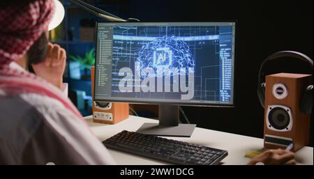 Qualified data scientist updating neural networks, writing complex binary code scripts. Certified teleworking man in home office uses digital device programming to upgrade AI Stock Photo