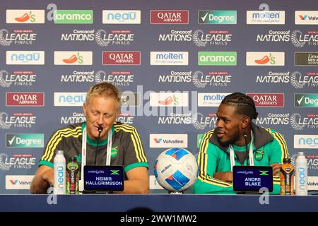 Arlington, Texas, USA. 20th Mar, 2024. Jamaica national football team captain ANDRE BLAKE looks at HEIMIR HALLGRIMSSON, Jamaica's national football team manager as he addresses the media on Wednesday at AT&T Stadium in Arlington, Texas. The press conference was held the day before two soccer matches are to be held at AT&T Stadium. The first of the two matches will see USA vs Jamaica at 6:00 pm CST followed by Panama vs Mexico at 9:15 pm CST. There will be four more matches. The first two matches sees Canada vs Trinidad and Tobago at 3:00 pm CST followed by Costa Rica vs Honduras at 6:15 pm Stock Photo