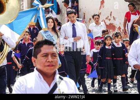 Antigua, Guatemala. 20th Mar, 2024. The Semana Santa Festival Queen, surrounded by school children parades through the historic center in preparation for Holly Week, March 20, 2024 in Antigua, Guatemala. The opulent processions, detailed alfombras and centuries-old traditions attract more than 1 million people to the ancient capital city. Credit: Richard Ellis/Richard Ellis/Alamy Live News Stock Photo
