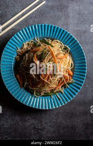 Schezwan noodles or hakka chow mein served in a bowl. Stock Photo