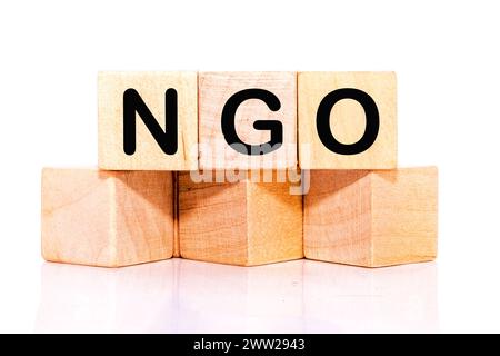 NGO (Non-Governmental Organization) sign on wooden cube Stock Photo