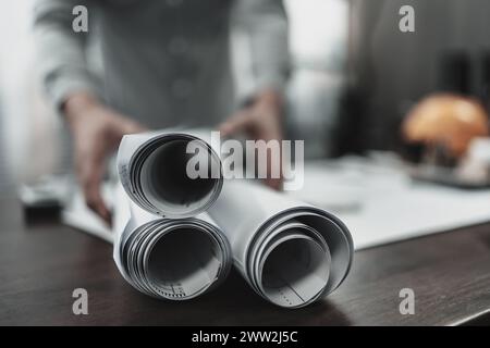 Rolls of paper layout factory, industry on engineering drawings. Engineer, Architect, Industry and factory concept. Stock Photo