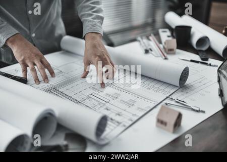 Architect engineer read drawing design working on blueprint. House planning design and construction concept. Stock Photo