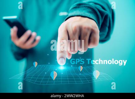 Man hand using smartphone with gps navigation map icon on light green background, Concept of online navigation and GPS, Destination travel maps and fi Stock Photo