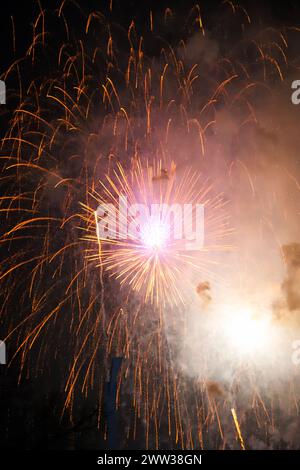 The beautiful fireworks of different colors and shapes exploding in the sky of Valencia during the Fallas celebration Stock Photo