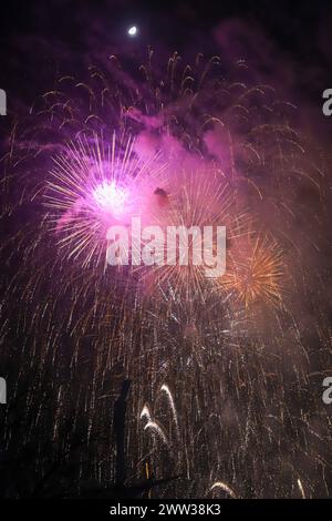 The beautiful fireworks of different colors and shapes exploding in the sky of Valencia during the Fallas celebration Stock Photo