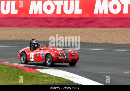Chris Keith Lucas and Kerry Wilson's Red, 1951, Jaguar XK120 Roadster, during the MRL RAC Woodcote Trophy, at the 2023 Silverstone Festival Stock Photo