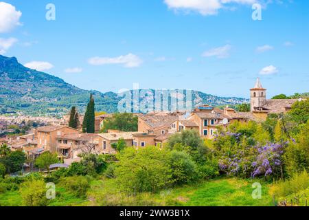 Southern village of Biniaraix with small church, houses, buildings, view towards Soller, rural scenery in the sunshine, mountain village with Stock Photo