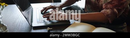 Header with hands of businesswoman working on laptop Stock Photo