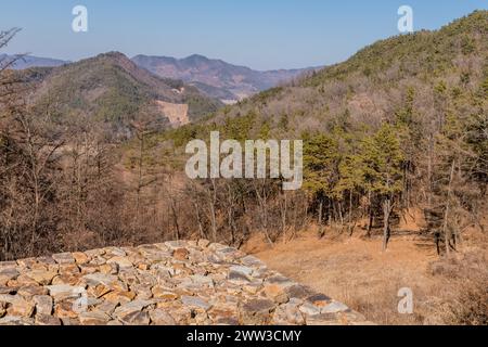 Landscape of mountain valley from atop stone fortress wall in Boeun, South Korea Stock Photo