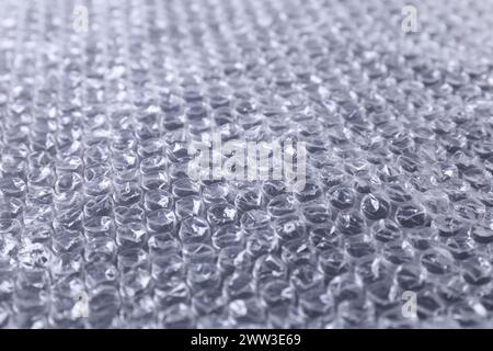 Transparent bubble wrap on black background, closeup Stock Photo
