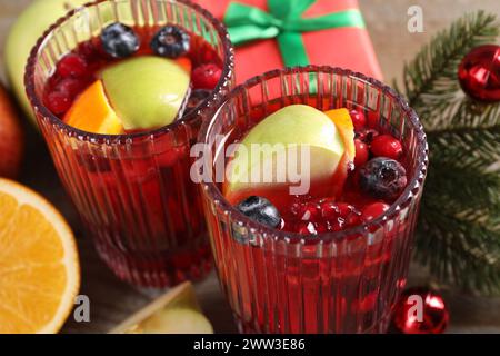 Aromatic Christmas Sangria drink in glasses on table, closeup Stock Photo