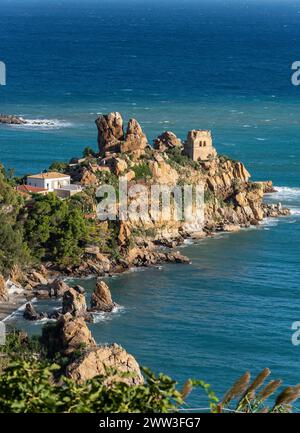 Ruins of Torre Caldura Castle on a rocky promontory jutting into the ...