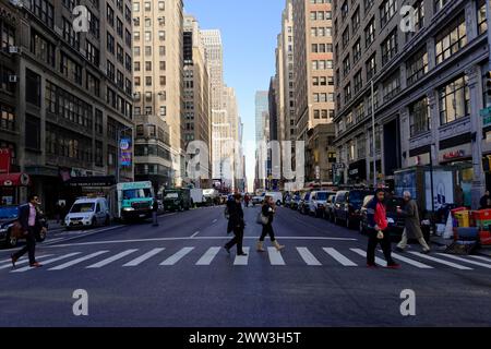 View of a busy city street with pedestrians crossing the street, Manhattan, New York City, New York, USA, North America Stock Photo