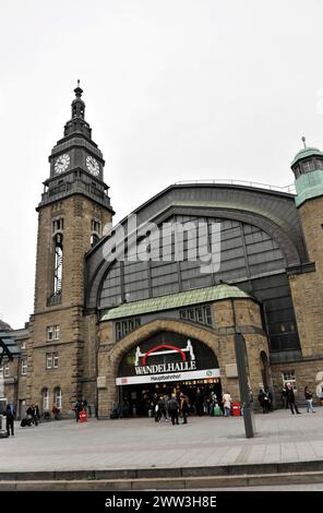 Historic railway station with tower clock and people walking past the entrance, Hamburg, Hanseatic City of Hamburg, Germany Stock Photo