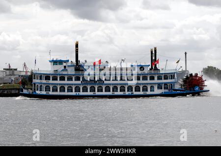 An antique paddle steamer named 'Louisiana Star' sailing on the water against a cloudy sky, Hamburg, Hanseatic City of Hamburg, Germany Stock Photo