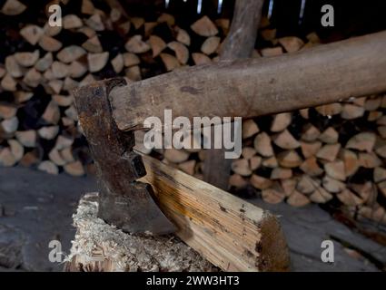 Close shot of axes chopping wood Stock Photo