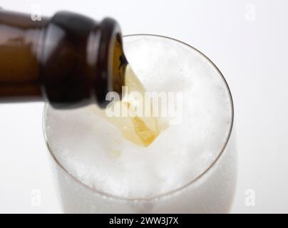 Beer is poured from a beer bottle into a beer glass, 07.12.2016 Stock Photo