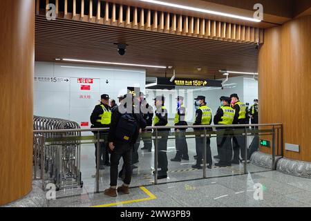 Shanghai, China. 21st Mar, 2024. Policemen are on duty outside the Jing'an Apple Store in Shanghai, China, on March 21, 2024. On the same day, the Shanghai Apple Jing'an Store, reported to be the largest Apple store in Asia and the highest specification retail store in China and Asia, officially opens. It is second only to New York's Fifth Avenue retail store in terms of global specifications. (Photo by Costfoto/NurPhoto) Credit: NurPhoto SRL/Alamy Live News Stock Photo