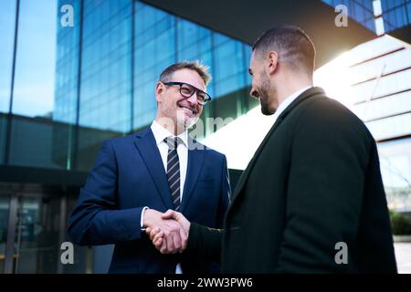 Cheerful smiling team of diverse business people in formal suit looking confident at camera Stock Photo