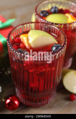 Aromatic Christmas Sangria drink in glasses on table, closeup Stock Photo