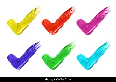 Paint strokes in shape of tick marks on white background, top view Stock Photo