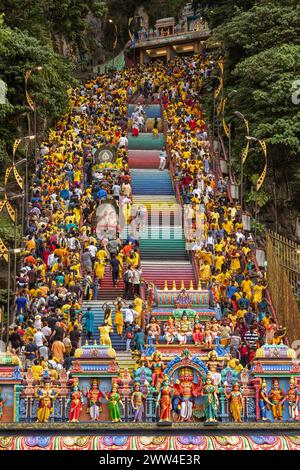 Visitors celebrating the Thaipusam Hindu festival walk up the 272 steps staircase leading to Malaysia's Batu Caves Hindu temple in Kuala Lumpur Stock Photo