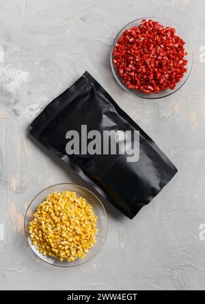 Freeze-dried berries and fruits, dried raspberries, strawberries, mangoes on a light background, top view. Dehydrated forest berries. Stock Photo