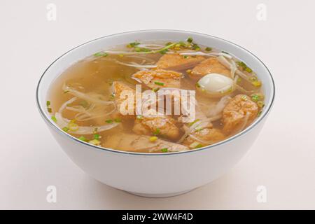 Banh canh cha ca Nha Trang, Rice noodles soup with fish cake from Nha Trang , Vietnamese food isolated on white background, close-up Stock Photo