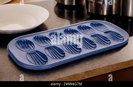 Silicone mold for baking cookies on the kitchen table, macro. Stock Photo