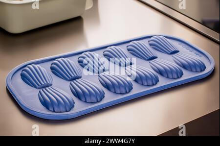 Silicone mold for baking cookies on the kitchen table, macro. Stock Photo