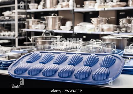 Silicone mold for baking cookies on the background of shelves with dishes, macro. Stock Photo