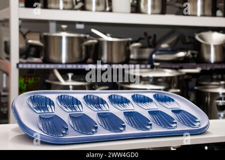 Silicone mold for baking cookies on the background of shelves with dishes, macro. Stock Photo