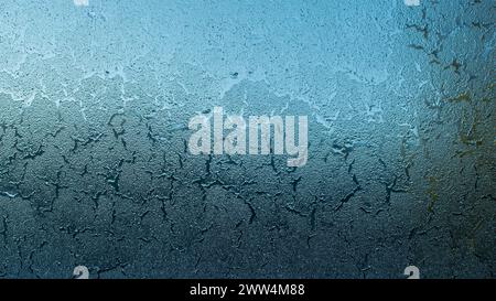 Cracked frost texture on a car window. Abstract winter background Stock Photo
