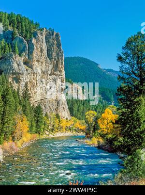 fall colors and cliffs along the gallatin river near gallatin gateway, montana Stock Photo