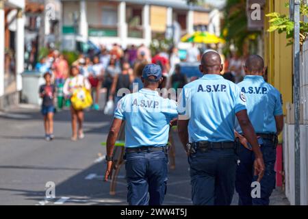 Saint-Gilles les bains, La Réunion - June 25 2017: Three agents of the 'A.S.V.P.' (Agent de surveillance de la voie publique) on patrol during the car Stock Photo