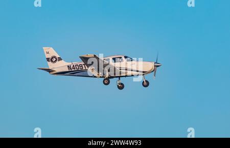 FORT MYERS, FLORIDA, USA - 15 FEB 2024. PIPER ARCHER III flies in the blue sky on a sunny day in Fort Myers on the Gulf Coast. Florida, USA Stock Photo
