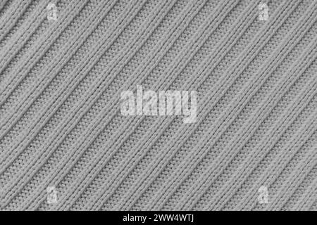 Jersey textile background , gray diagonal striped knitted fabric. Woolen knitwear, sweater, pullover surface texture, textile structure, cloth surface Stock Photo