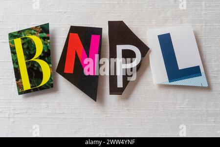 The acronym "BNPL" slang using cut-out paper letters in the ransom note effect typography, USA Stock Photo