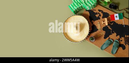 Pinata, map, Mexican flag and beach accessories on green background with space for text, top view. Travel concept Stock Photo